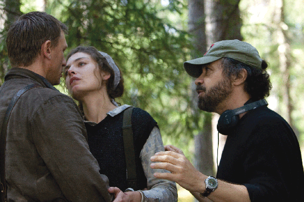 Edward Zwick (right) directs Daniel Craig and Alexa Davalos on the set of Defiance. (Photo: Karen Ballard)