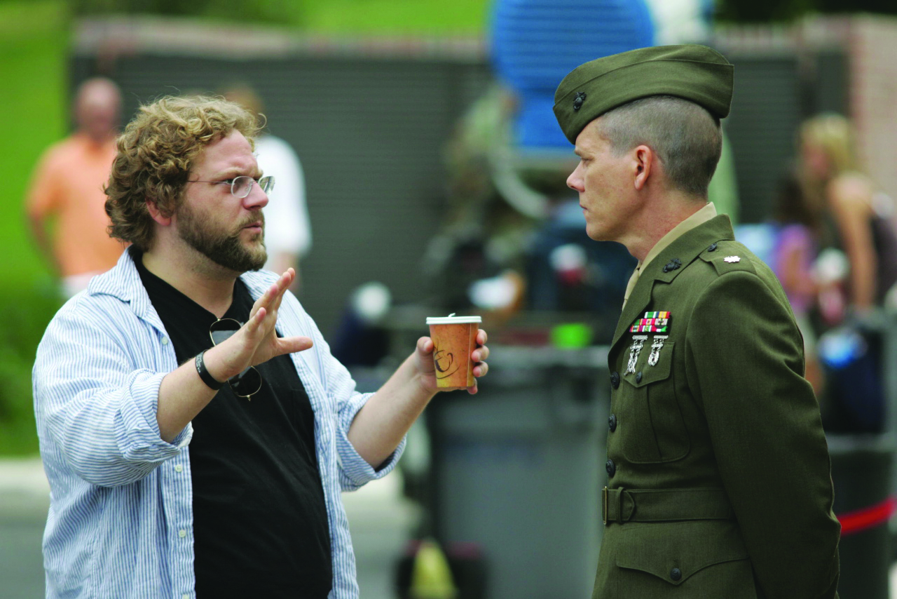 Writer and director of the HBO film Taking Chance, Ross Katz (left), talks to the film’s star, Kevin Bacon, who portrays the Marine Corps officer who escorts the body of a young soldier home. (Photo: James Bridges)