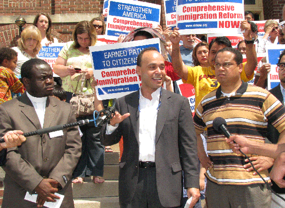 Rep. Luis Gutierrez, a member of Congress from the Chicago area, spoke at a press conference outside of Incarnation Church on Sunday. He is flanked by Rev. Alexander Collins, left, of Redeemed Life Church in Mounds View, and Rep. Keith Ellison. (Photo: Mordecai Specktor)