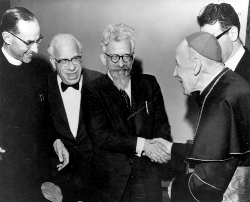 Rabbi Albert G. Minda (second from left) looks on as Rabbi Abraham J. Heschel (center) shakes hands with Cardinal Augustin Bea during a March 31, 1963, meeting in New York City. (Photo: Courtesy of Roland Minda)