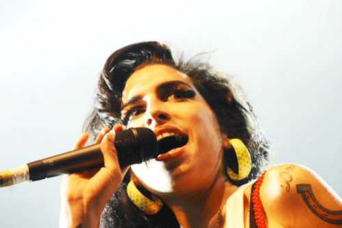 Amy Winehouse, shown at a June 2007 rock festival in France, foretold her own fate in "Back to Black," says Dvora Meyers, when she sang, "I tread a troubled track/My odds are stacked/I go back to black.” (Photo: V. Gable - Festival Eurockéennes)