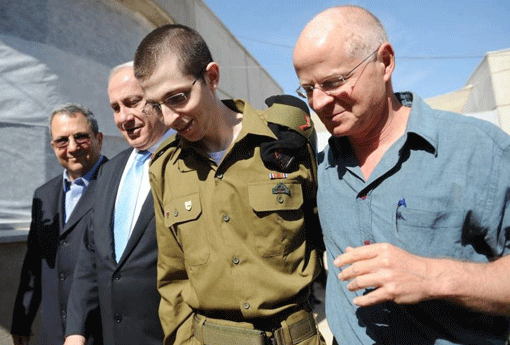 Gilad Shalit is reunited with his father, Noam Shalit (right), at Tel Nof air base