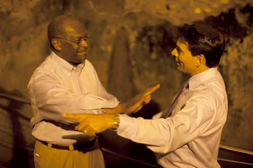 Danny Danon, a Knesset member and a leader of the settlement movement, making a point to Herman Cain after leading the Republican presidential candidate on a tour of the tunnels beneath Jerusalem's Western Wall in August. (Photo: George Lange Studios)