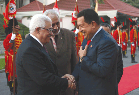 Venezuelan President Hugo Chavez (right) shaking hands with Palestinian President Mahmoud Abbas in the Venezuelan capital of Caracas on Nov. 27, 2009 (Photo: Omar Rashidi / PPO via Getty Images)