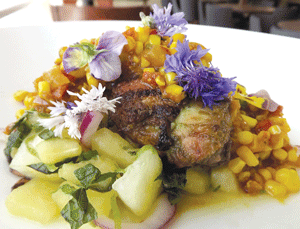 U of M grilled chicken with sweet corn relish and watermelon salad is just one of the many optins available on the banquet menu. (Photo: Courtesy of the Campus Club)