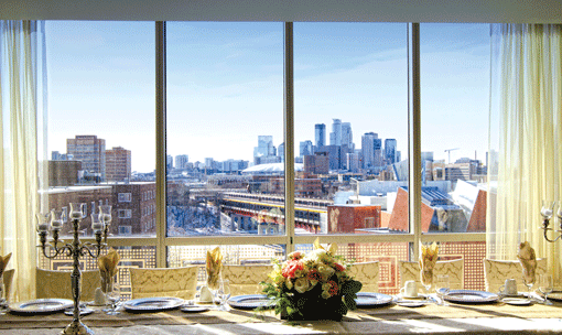 The West Wing Dining Room comes complete with a dramatic view of the Minneapolis skyline. (Photo: Delight Photography)