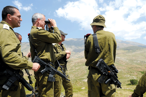 IDF Chief of Staff Benny Gantz (with binoculars) tours the Israeli border with Syria on May 21. (Photo: Tal Manor / IDF Spokesman / Flash 90 / JTA)