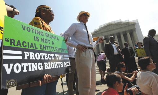 Supporters of the Voting Rights Act waiting outside the U.S. Supreme Court building in Washington after the court struck down a section aimed at protecting minority voters on June 25. (Photo: Win McNamee / Getty)