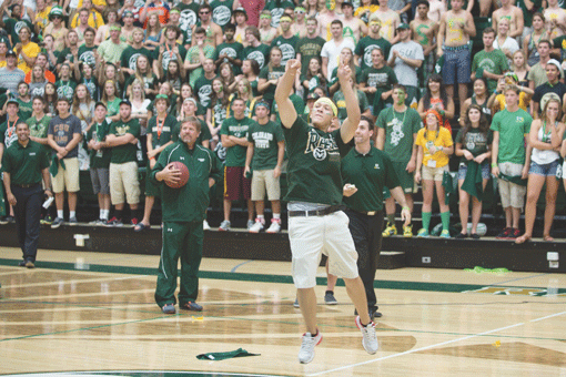 Colorado State University freshman Andrew Schneeweis sinks a half-court shot at a pep rally to win a year's free tuition. Photo: JTA/Courtesy of John Eisele of CSU Photography.