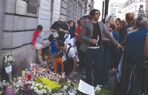 A vigil was organized on May 25 by the Jewish community outside the Jewish Museum of Belgium in Brussels where a gunman killed four people the previous day. (Photo: Cnaan Liphshiz / JTA)