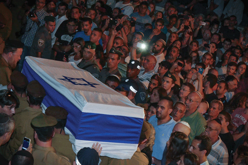 Israelis attending the funeral of Texas-born Israeli soldier Sean Carmeli, who was killed during combat in Gaza, at a military cemetery in Haifa on July 21. (Photo: Gili Yaari / Flash 90)