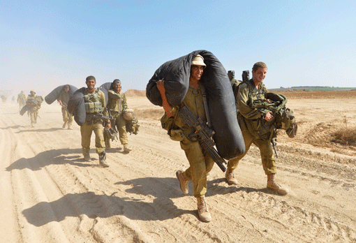 Israeli soldiers leaving the Gaza Strip seen near the border between Israel and the Hamas-controlled coastal area on Aug. 4. (Photo: Flash90)