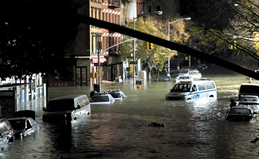 Submerged cars are seen on a Manhattan street following a tidal surge caused by Hurricane Sandy, Oct. 30, 2012. (Photo: Christos Pathiakis / Getty Images)