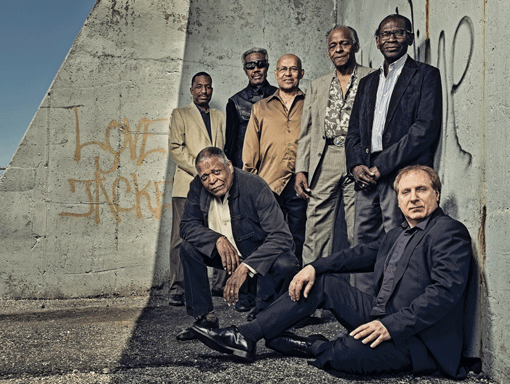 The Cookers are (standing, l to r): Donald Harrison, Billy Harper, Eddie Henderson, Cecil McBee, George Cables; and (front, l to r): Billy Hart and David Weiss.
