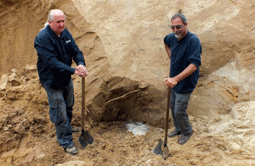 Israeli archaeologist Yoram Haimi (right) has been warning of threats to important historical artifacts at the Sobibor death camp in Poland. He is pictured there in September 2013. (Photo: Courtesy of Yoram Haimi)