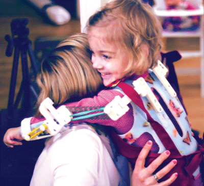 Stratasys and Magic Arms for the World used a 3D printed vest to enable Emma to give her mom a hug. (Photo: Courtesy of Stratasys)