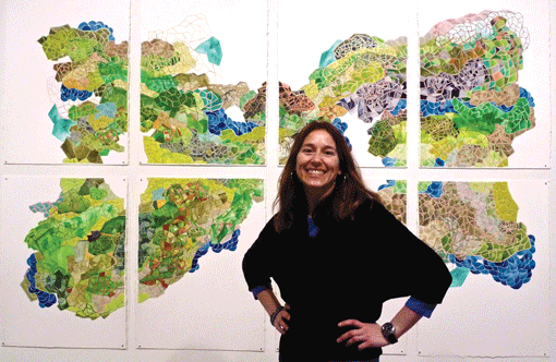 Keren Kroul stands in front of a piece titled “Unquiet Mind,” from her Charted Memories series of paintings. (Photo: Courtesy of Rimon: The Minnesota Jewish Arts Council)