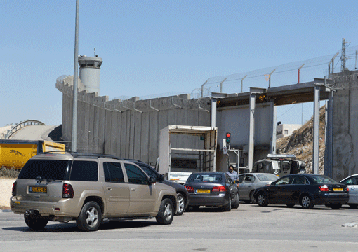 Cars line up to enter the West Bank at the Kalandia checkpoint north of Jerusalem. Anne Maertz writes that Omar, her Palestinian colleague, was strip-searched three times on one attempt to cross into Israel from Jordan. (Photo: Mordecai Specktor)