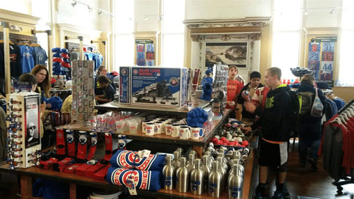 The Cubs Den, the team store of the South Bend Cubs minor league baseball team, occupies a former synagogue adjacent to the ballpark. Rabbi Davis writes: “Not mincha but merchandise is the name of the game here. The juxtaposition is a jarring mixture of kitsch and kedusha (holiness)…. Where the bima once rose, cash registers now sit.” (Courtesy of The Elkhart Truth)