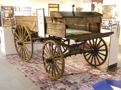 The century-old cart used by Hyman Kaplan when he started his scrap business in Northfield, Minn., is the centerpiece of Peddlers to Processors: Scrap Stories from the Upper Midwest, which is on display through May 26 at the Sabes JCC. (Photos: Erin Elliott Bryan)