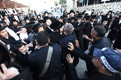 Haredi Orthodox men clash with police in the Israeli city of Beit Shemesh on Dec. 26. (Photo: Kobi Gideon / Flash90 / JTA)