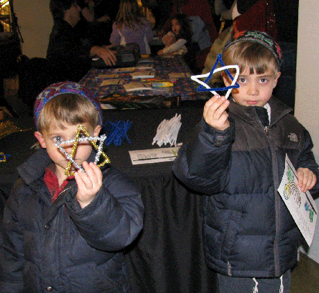 Julian (left) and Jackson Berenberg proudly display their Jewish stars fashioned from pipe cleaners.