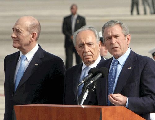 Former Pres. George W. Bush will be featured speaker at a Sept. 21 fundraising event at Beth El Synagogue. Bush (right) is shown arriving in Israel on Jan. 9, 2008, and being greeted by then Prime Minister Ehud Olmert (left) and President Shimon Peres. (Photo: Brian Hendler/JTA)