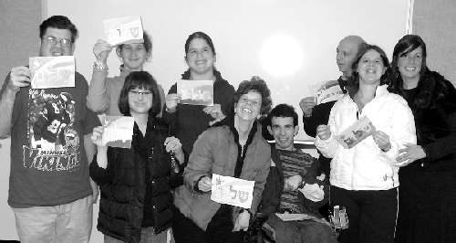 Staff and students of Sha’arim’s newly launched program for Jewish young adults with disabilities pose with their Shalom sand art creations. Adult Darkaynu is held on Wednesdays at the Sabes JCC and is run in collaboration with the JCC’s Inclusion Program. (Photo: Courtesy of Sha’arim)