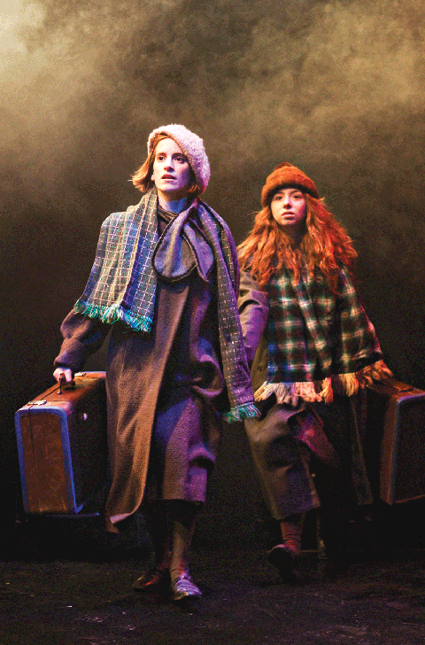 Sabine (Elise Langer, left) and her sister Helka (Devon Solorow) are on the run in Hiding in the Open, a play based on the memoir of the same name by Dr. Sabina Zimering. (Photo: Lauren B. Photography)
