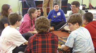 HMJDS Upper School Director Harry Adler facilitates a small-group discussion among fifth and sixth grade students. (Photo: Erin Elliott Bryan)