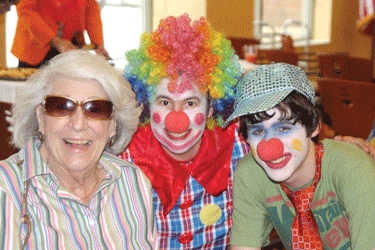 Sue Lund (center) and her son, Jeremy, visit with a resident at Sholom Home East in St. Paul. (Photos: Courtesy of Sue Lund)