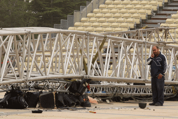 A man standing next to the lighting structure that collapsed at Mount Herzl during the preparations for next weeks Israel Independence Day ceremony, killing a young woman and injuring several people on April 18. (Photo: Nati Shohat/FLASH90/JTA)