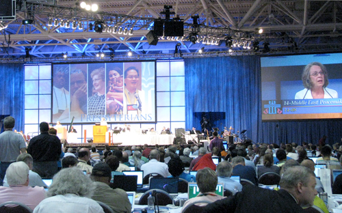 Commissioners at the Presbyterian Church (U.S.A.) General Assembly in Minneapolis debate Middle East Study Committee report.