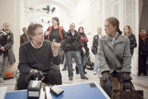 Director John Madden (left) and Academy Award-winner Helen Mirren on the set of “The Debt.” (Photo: Laurie Sparham/Focus Features)