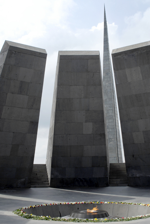 Tsitsernakaberd is a memorial in Yerevan, Armenia, dedicated to the victims of the Armenian Genocide.  The eternal flame inside the memorial. The 44-meter stele symbolizes the national rebirth of Armenians. Twelve slabs are positioned in a circle, representing the 12 lost provinces in present day Turkey. In the center of the circle, at a depth of 1.5 meters, there is an eternal flame. (Photo: iStockphoto.com / Marianna Meliksetyan)