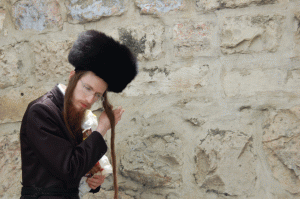 An Orthodox Jew is pictured at the Wailing Wall in a scene from Jerusalem: Center of the World. (Photo: Courtesy of Two Cats Productions)