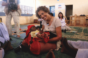 American Jewish World Service President and Executive Director Ruth Messinger holds a Darfuri newborn at a refugee camp in Chad. Messinger will be the scholar-in-residence March 26-28 at Temple Israel in Minneapolis. (Photo: Mia Farrow)