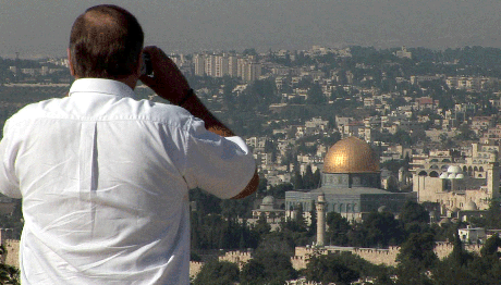 An evangelical Christian looks out over the Dome of the Rock mosque, in the Old City of Jerusalem, in a scene from the documentary Waiting for Armageddon, which will be shown later this month at the St. Anthony Main Theatre. (Photo: Courtesy of First Run Features)